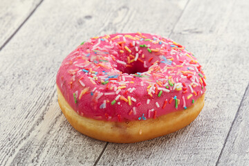 Sweet glazed struwberry donut with icing