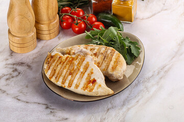 Grilled chicken breast served arugula
