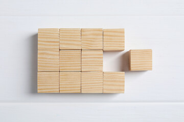 Blank cubes on white wooden table, flat lay