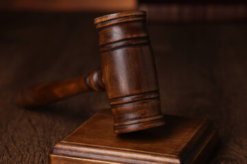 Law concept. Judge's gavel on wooden table, closeup