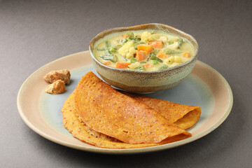 Indian dosa or Adai with mixed lentils with Mixed veg curry or kurma