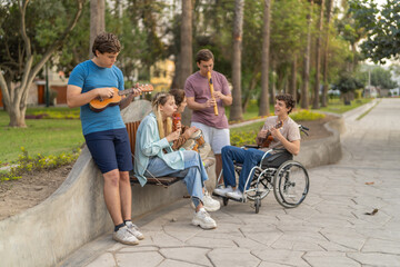 Disabled man and friends playing music in a park