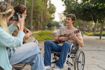 Young disabled man playing ukulele while woman taking a photo