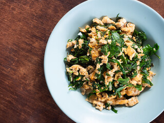 stir fried Pak liang, melindjo or baegu leaves, with egg