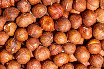 Scattered Peeled Hazelnut - Top View. Background from Hazelnuts. Natural High-Calorie Snacks