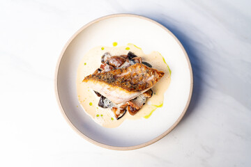 grilled Barramundi steak with mushroom sauce