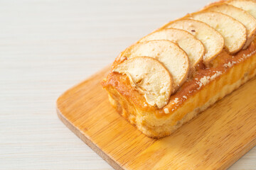 apple loaf crumbled on wood board