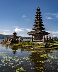 Ulun Danu Beratan Temple in northern Bali. An important place for local people. Sunny morning. Temple on Lake Beratan. Indonesia.