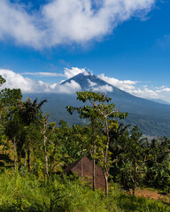 View of the Agung volcano. Sunny day. Clouds. Amed. Bali. Indonesia