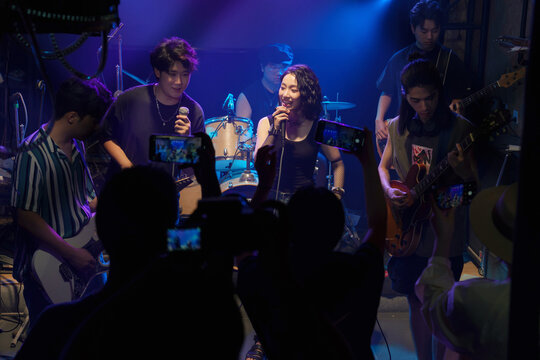 Young band performing on stage