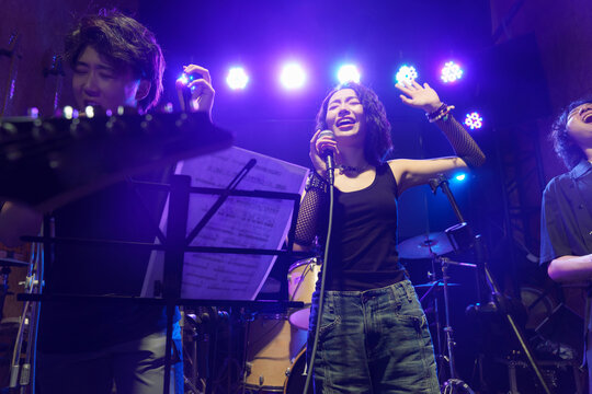 Young band performing on stage