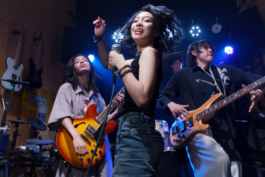 A young band performing on stage