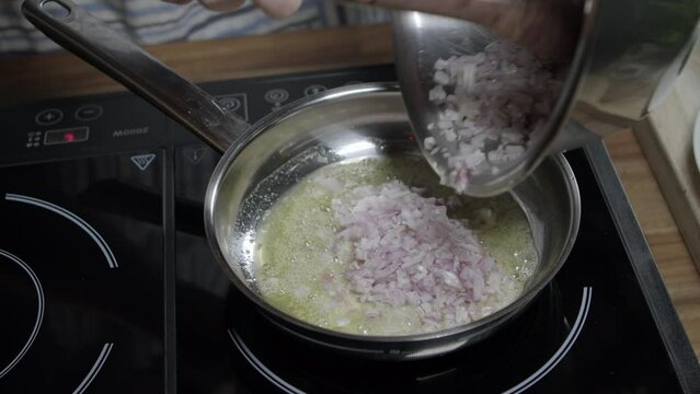 Adding onion to the meat sauce mixture, coffee in paris butter. Hot pan on induction stove