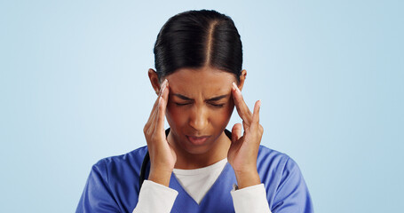 Doctor, studio or woman with headache, emergency or fatigue in medical healthcare crisis or head pain. Depression, face or tired nurse with burnout, migraine or stress isolated on blue background - obrazy, fototapety, plakaty