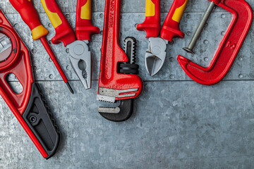 Red Construction Tools On Metalic Background.