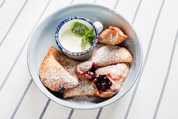 cherry pies with cream closeup