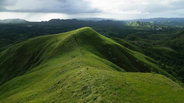 Sunlight on Mount Labawan ridge trail and dramatic shadow on hillside