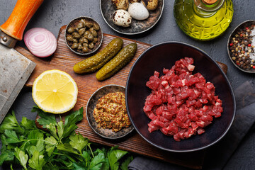 Cooking savory beef tartare and brown bread toasts