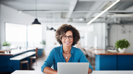 Middle Aged Business Woman Smiling at the Camera in a Modern Office