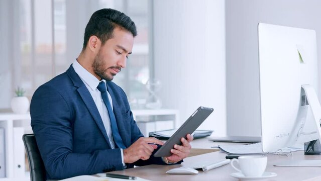 Digital tablet, serious businessman sending an email, searching the internet and browsing online. Entrepreneur using modern technology while writing a business proposal for a startup company
