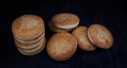 Beautiful round cookies on a black background. A few cookies. A bunch of cookies.