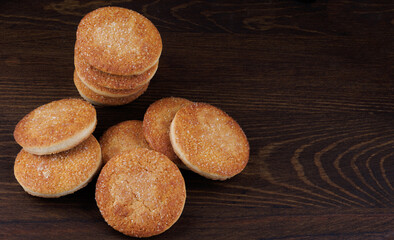 Beautiful round cookies on a wooden board. A few cookies. A bunch of cookies.