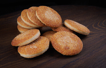 Beautiful round cookies on a wooden board. A few cookies. A bunch of cookies.