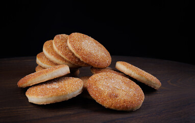 Beautiful round cookies on a wooden board. A few cookies. A bunch of cookies.