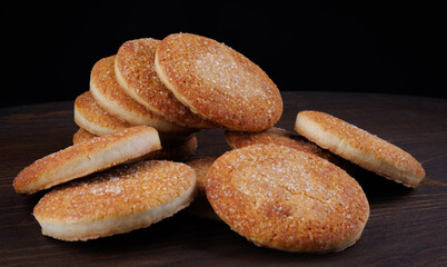 Beautiful round cookies on a wooden board. A few cookies. A bunch of cookies.