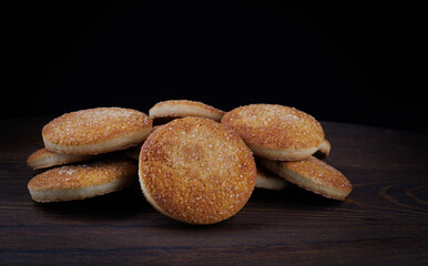 Beautiful round cookies on a wooden board. A few cookies. A bunch of cookies.