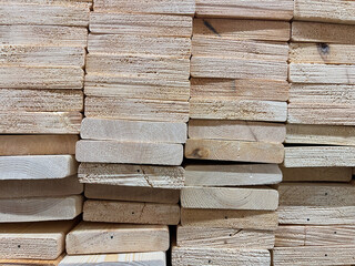 A stack of new wood panels on a construction site. Industrial background.