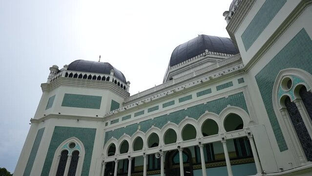 beautiful view from under the grand mosque with a clear sky in the background