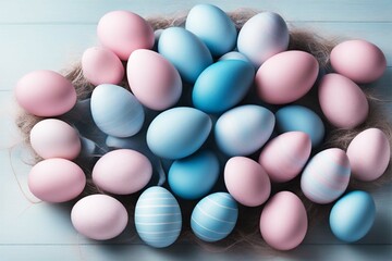 Pink and blue Easter eggs lie chaotically. View from above. Easter holiday background.