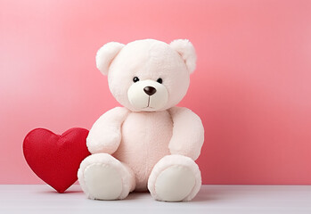 Teddy bear holding a heart-shaped pillow with plank