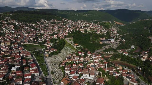 Aerial view of Alija Izzet Begovic cemetery in Bosnia, city ​​view built on the mountain slopes