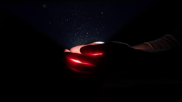 Light coming out of men's palms