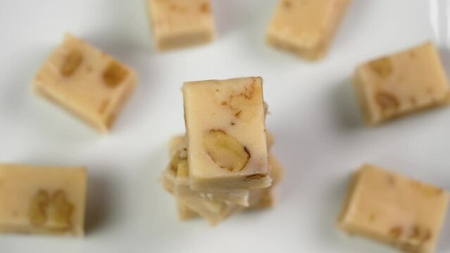 Typical sliced Spanish turron with nuts. Traditional Christmas treats. Rotation