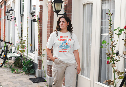 Mockup of woman wearing customizable t-shirt on street