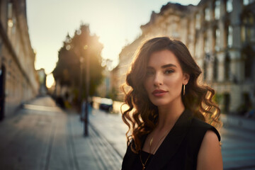 Fototapeta premium Vogue style close-up portrait of beautiful woman with long curly