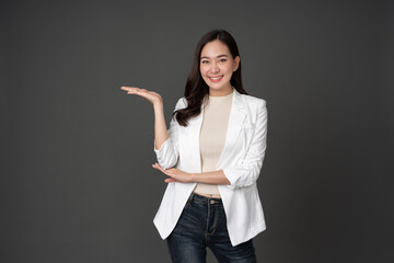 Asian female executive with long hair Pose for photos like a model. Raise your hand to present...