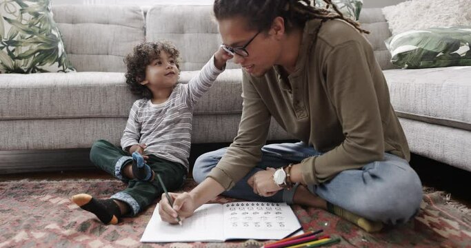 Homework, drawing or father teaching kid for education, playing or bonding together for child development. Family, artistic or creativity with dad, son or boy at home for learning, project or lesson