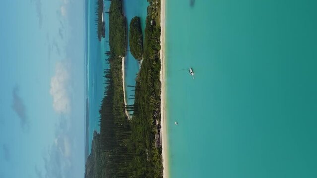 Establishing vertical aerial over Kuto and Kanumera Bays, white sand beach Isle of Pines.