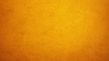 Smooth and luminous cement wall background with gold-orange gradient tones.