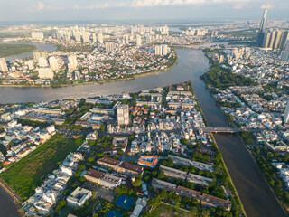 Obraz premium Panoramic view of Saigon, Vietnam from above at Ho Chi Minh City's central business district. Cityscape and many buildings, local houses, bridges, rivers