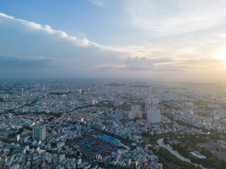 Naklejka na ściany i meble Panoramic view of Saigon, Vietnam from above at Ho Chi Minh City's central business district. Cityscape and many buildings, local houses, bridges, rivers