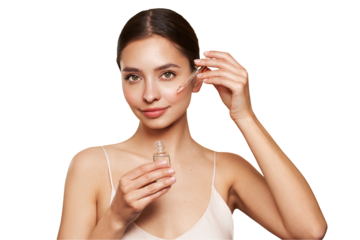 Young beautiful woman applying face serum with pipette. Cosmetic procedures for facial skin care