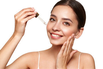 Young beautiful woman applying face serum with pipette. Cosmetic procedures for facial skin care