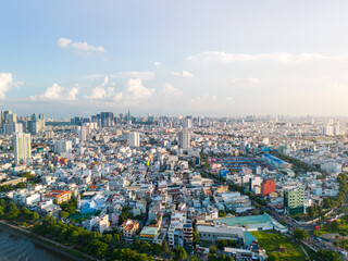 Obraz premium Panoramic view of Saigon, Vietnam from above at Ho Chi Minh City's central business district. Cityscape and many buildings, local houses, bridges, rivers
