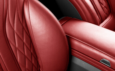 Car inside. Interior of prestige modern car. Comfortable red leather seats. Perforated leather...