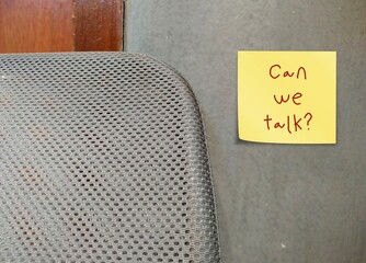 Note on a wall with handwritten text CAN WE TALK?, concept of difficult conversation, to approach...